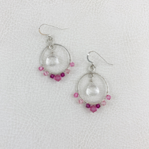 Various pink crystals wrapped on hoop style earrings