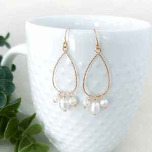 pearls dangle from teardrop rose gold hoop